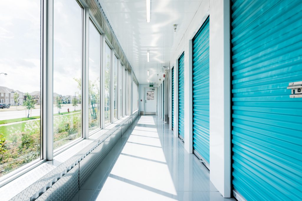 Hallway of UltraStor units on one side and windows facing the outdoors on the other side.